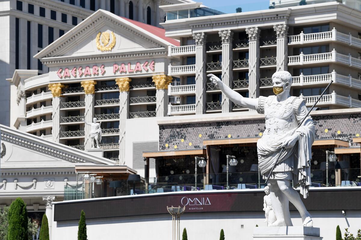 A masked Caesar welcomes guests to the hotel, which has rooms for less than $100 a night.