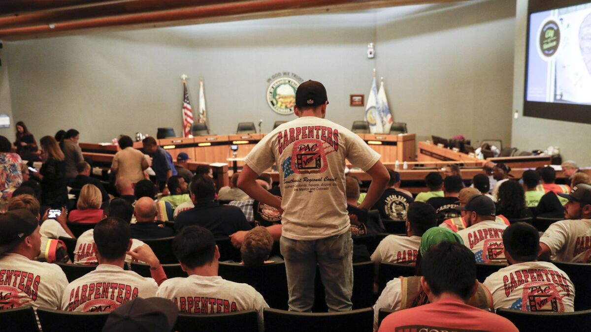 Union shirts were out in large numbers during the Anaheim City Council meeting, where the Council heard public comments on a minimum wage ballot measure aimed at raising Disney workers' wages, in Anaheim, Calif. on June 19.
