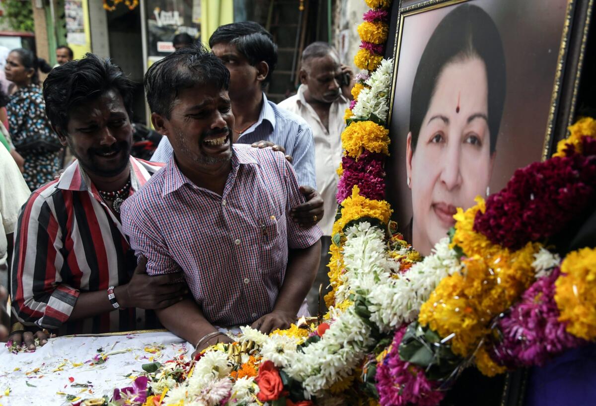 Supporters mourn while paying tribute to Jayaram Jayalalithaa, the south Indian actress-turned-political supremo, who died Monday at 68.