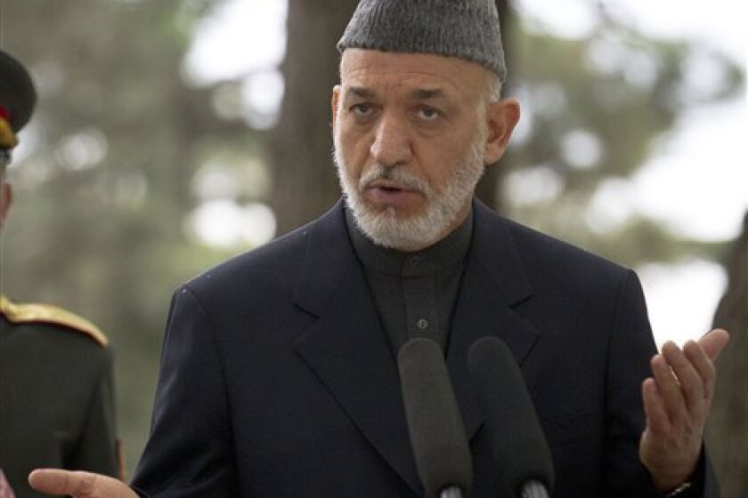 FILE - In this May 25, 2012 file photo, Afghan President Hamid Karzai speaks, in Kabul, Afghanistan. The Obama administration is considering a new gambit to restart peace talks with the Taliban in Afghanistan. The plan to send several Taliban detainees from the military prison at Guantanamo Bay, Cuba, to a prison in Afghanistan, could boost the credibility of Afghan President Hamid Karzai as he and U.S. officials try to draw the Taliban back to peace negotiations. (AP Photo/Anja Niedringhaus, File)