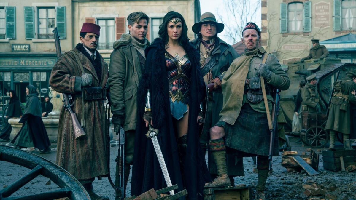 Said Taghmadui, left, as Sameer, Chris Pine as Steve Trevor, Gal Gadot as Wonder Woman, Eugene Braverock as the Chief and Ewen Bremner as Charlie in "Wonder Woman." (Clay Enos / Warner Bros. Entertainment)