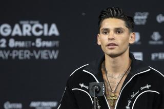 FILE - Super lightweight boxer Ryan Garcia speaks during a news conference.