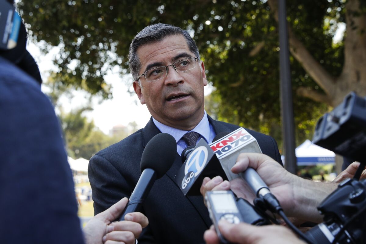 FILE - In this Thursday, Aug. 2, 2018, file photo, California Attorney General Xavier Becerra talks to reporters after a news conference at UCLA. President-elect Joe Biden has picked Becerra to be his health secretary, putting a defender of the Affordable Care Act in a leading role to oversee his administration’s coronavirus response. (AP Photo/Jae C. Hong, File)