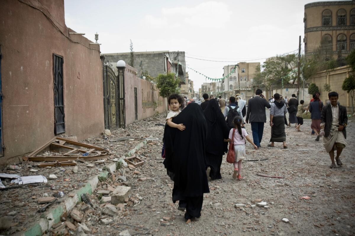 People flee after a Saudi-led airstrike in Sana, Yemen, on Wednesday.