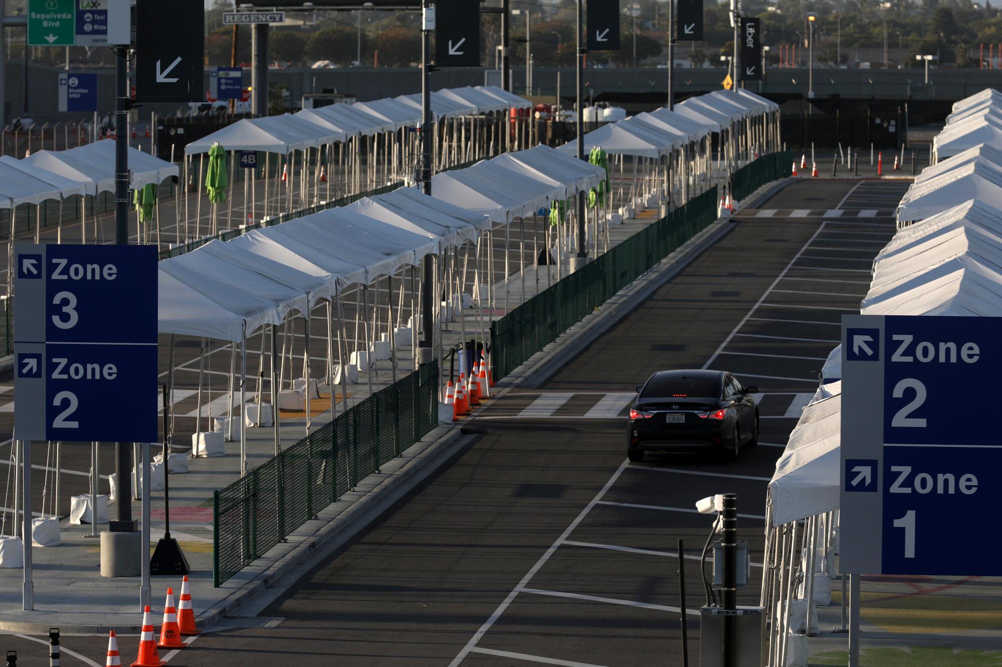 Taxi and ride-share pickup lanes are empty at LAX.