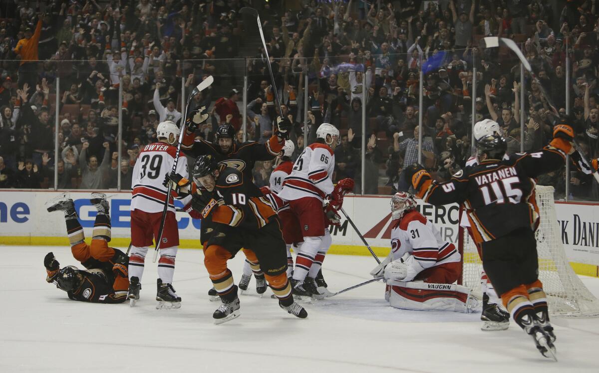 Cory Perry (10) celebrates after scoring the game-tying goal against the Carolina Hurricanes with 4:08 left in the third period at Honda Center. The Ducks beat the Hurricanes in overtime, 5-4.