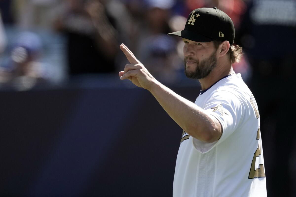 National League pitcher Clayton Kershaw, of the Los Angeles Dodgers, warms up before the MLB All-Star baseball game, Tuesday, July 19, 2022, in Los Angeles. (AP Photo/Jae C. Hong)