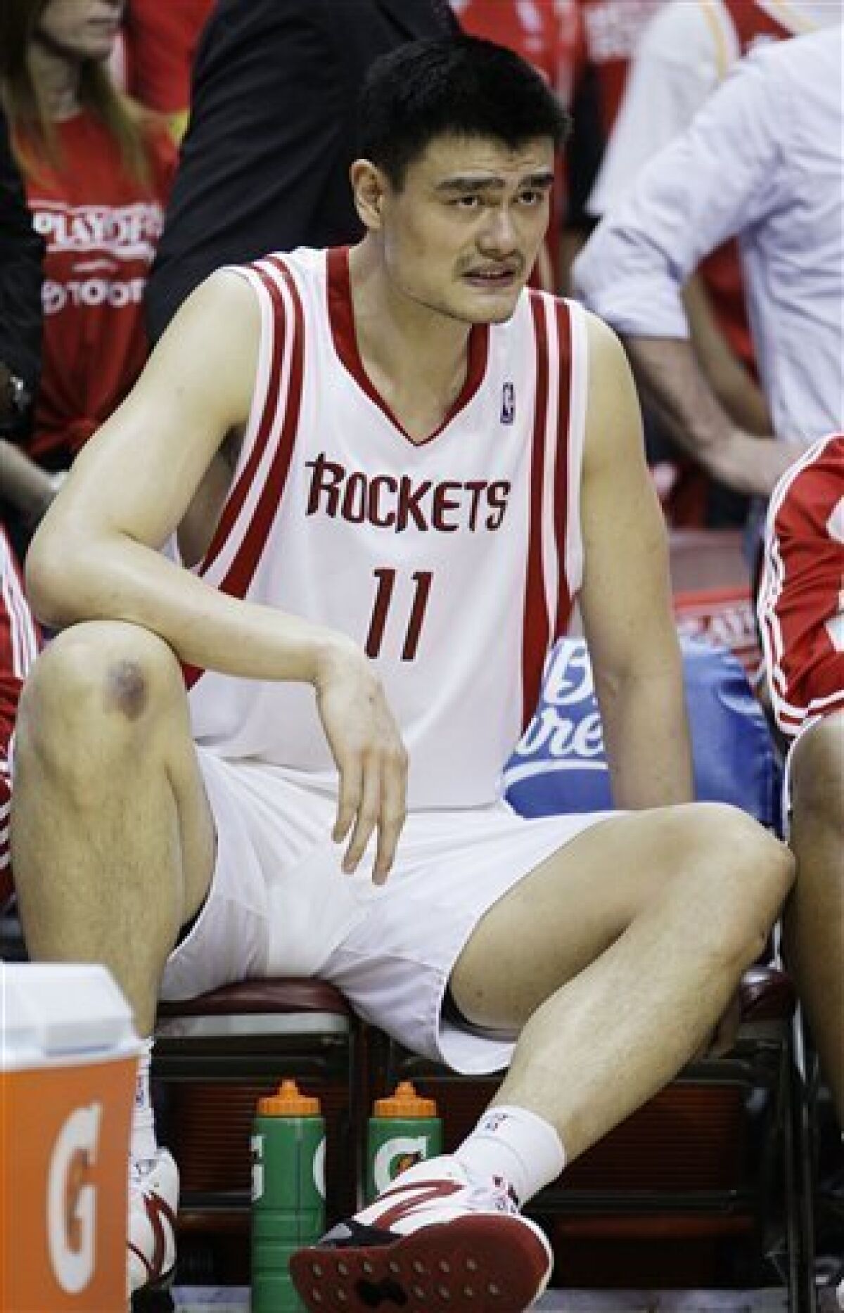 Houston Rockets center Yao Ming (11), of China, sits on the bench during the fourth quarter of Game 3 of a second-round Western Conference NBA playoff basketball game against the Los Angeles Lakers in Houston, Friday, May 8, 2009. Los Angeles won 108-94. (AP Photo/Eric Gay)