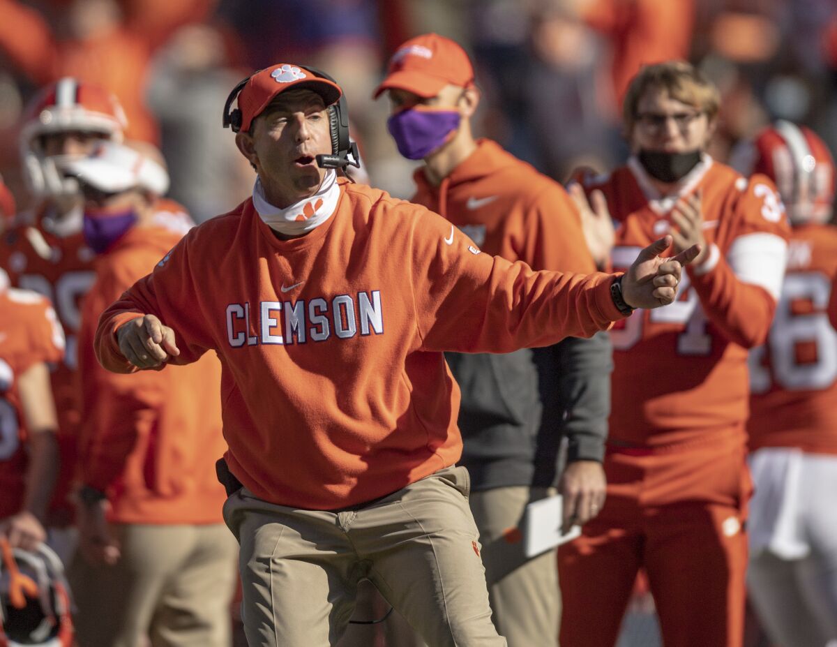 Clemson coach Dabo Swinney talks with players during the second half.