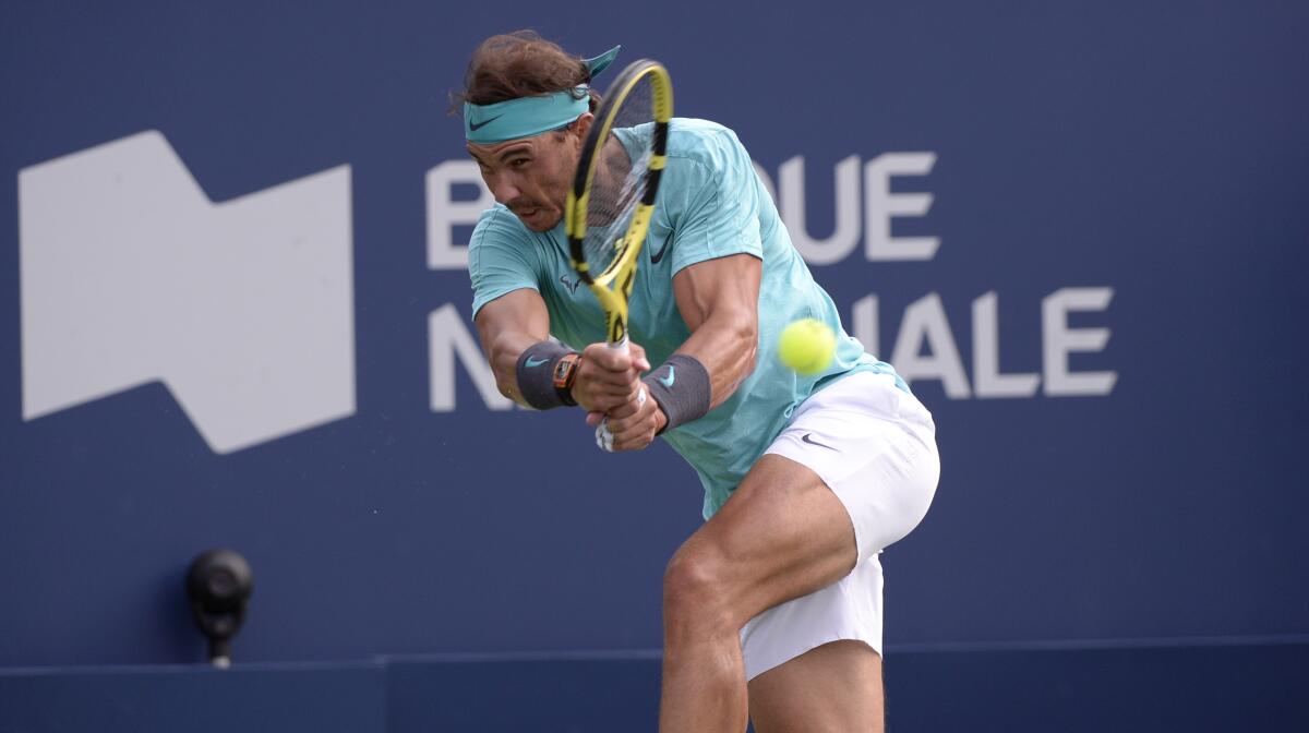 Rafael Nadal hits a return against Daniil Medvedev during the Rogers Cup final in Montreal on Aug. 11.