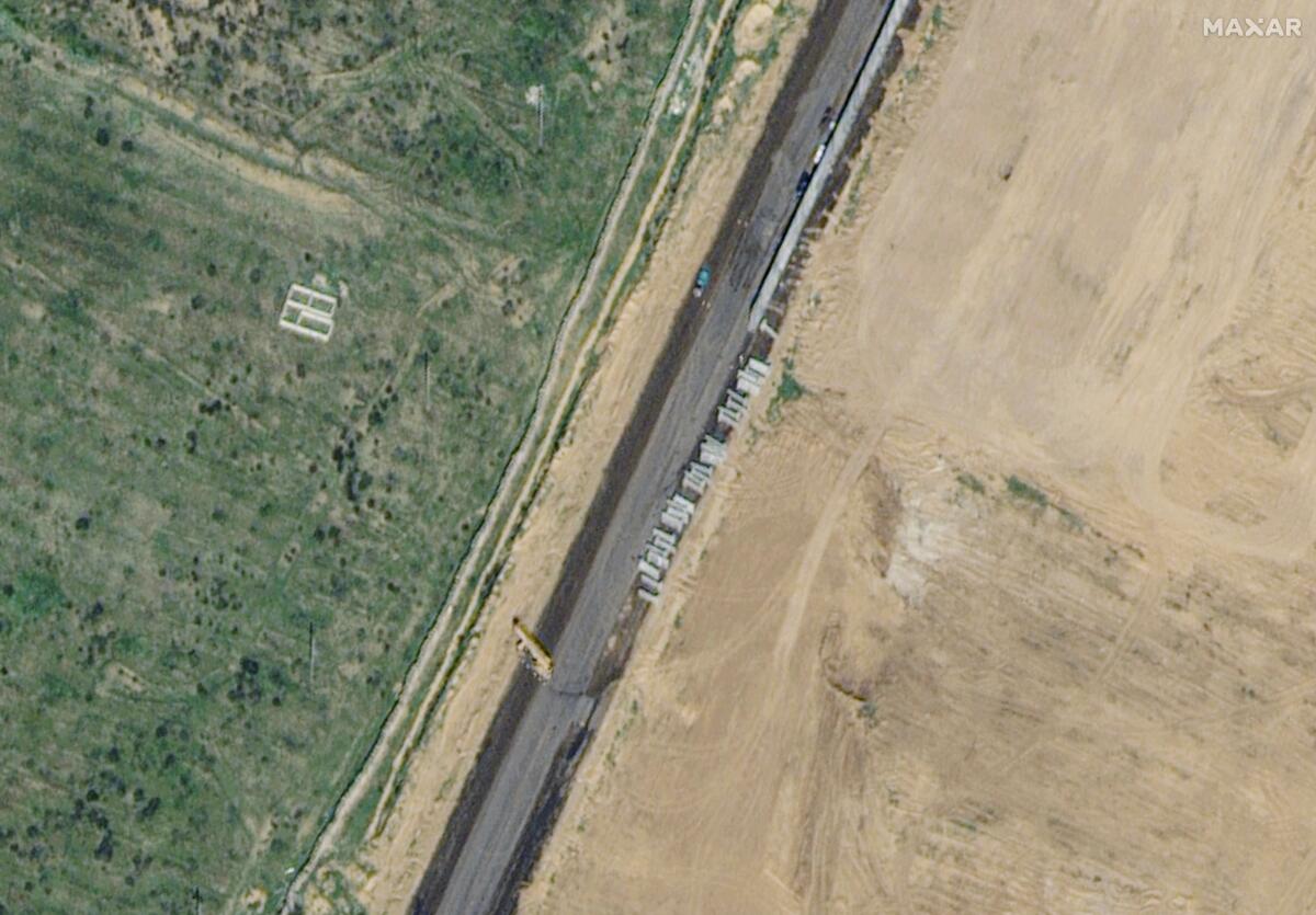 A satellite image shows wall construction 