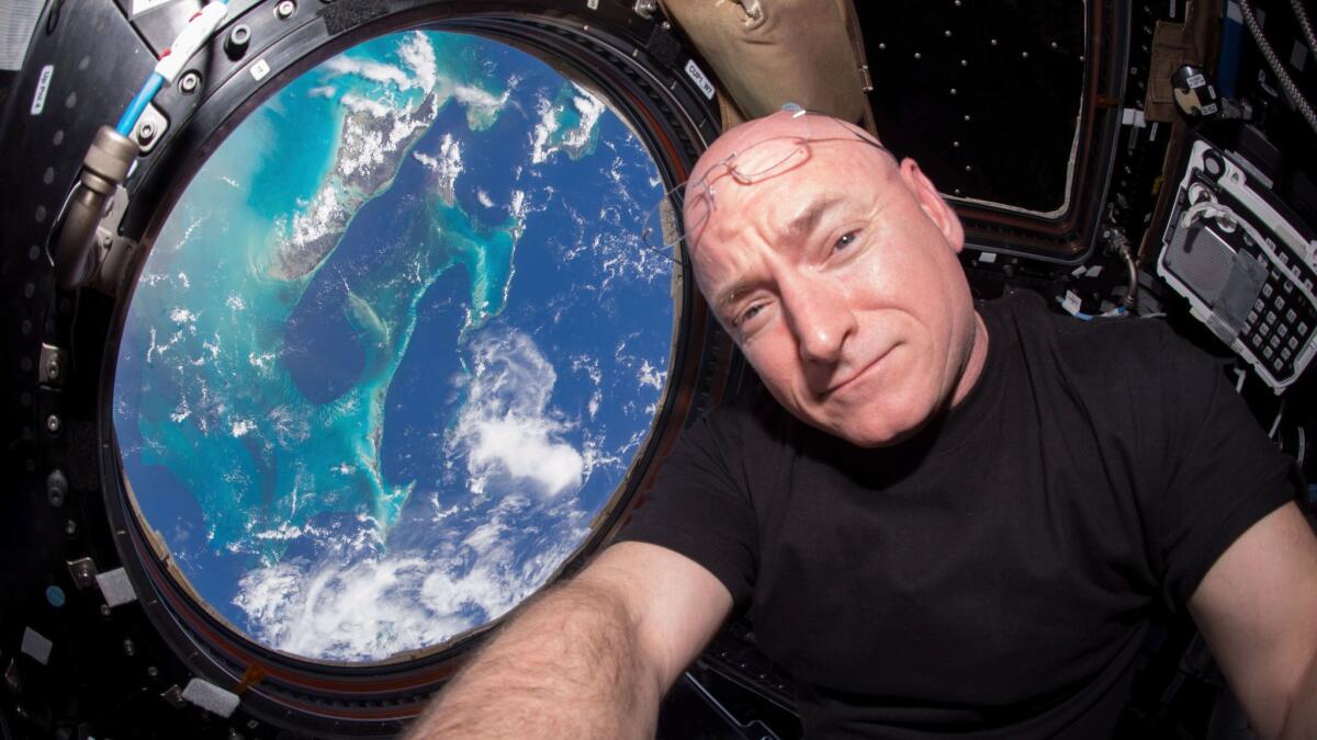 Astronaut Scott Kelly takes a photo of himself inside the International Space Station.