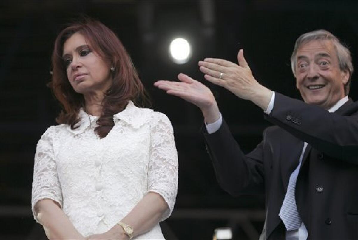 FILE - In this Dec. 10, 2007 file photo, Argentina's outgoing President Nestor Kirchner gestures toward his wife, Argentina's new President Cristina Fernandez, as they arrives to a music festival after her swearing-in ceremony outside the presidential palace in Buenos Aires, Argentina. According to state television in Argentina, Nestor Kirchner died on Wednesday Oct. 27, 2010 after suffering heart attacks at age 60. (AP Photo/Emiliano Lasalvia, File)