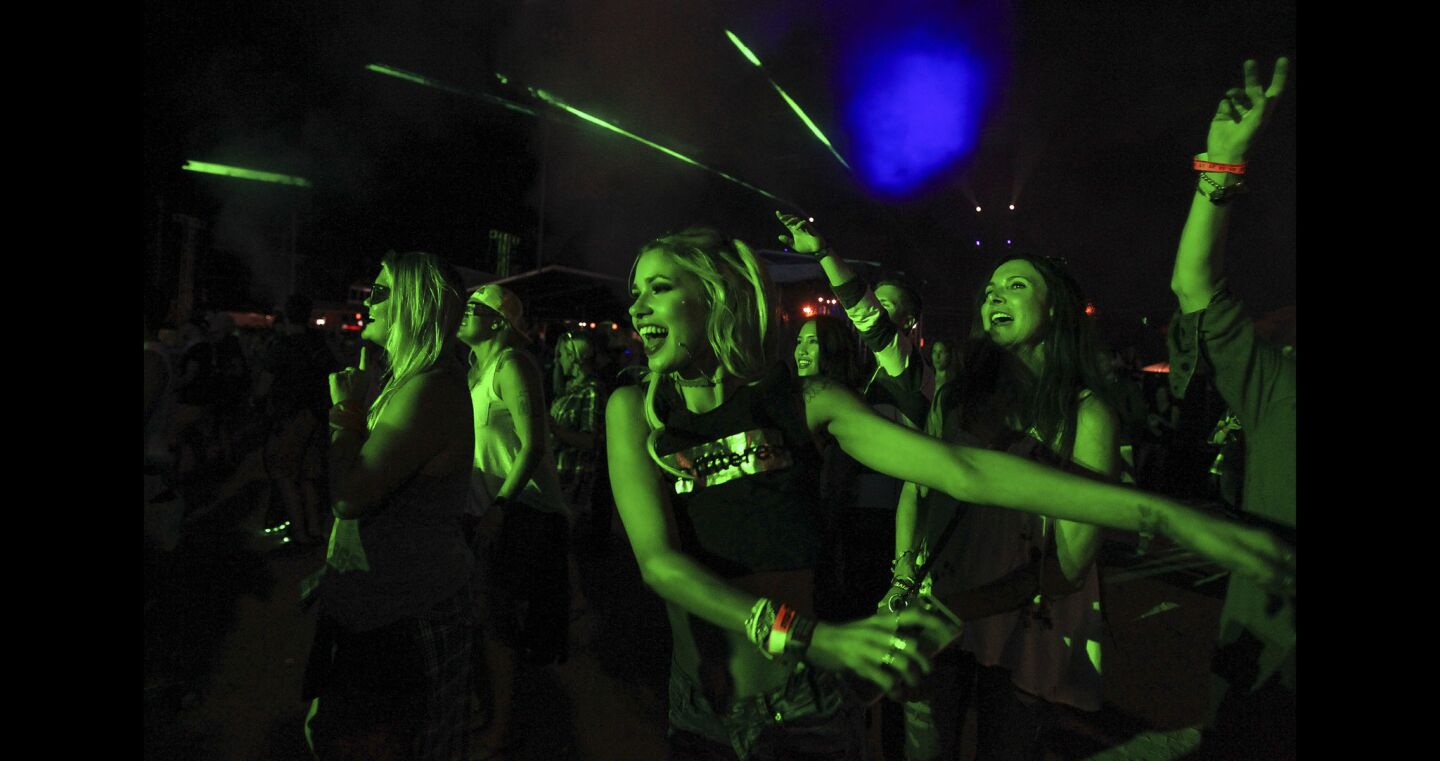 People dance to the music played by DJ David Guetta during KAABOO.