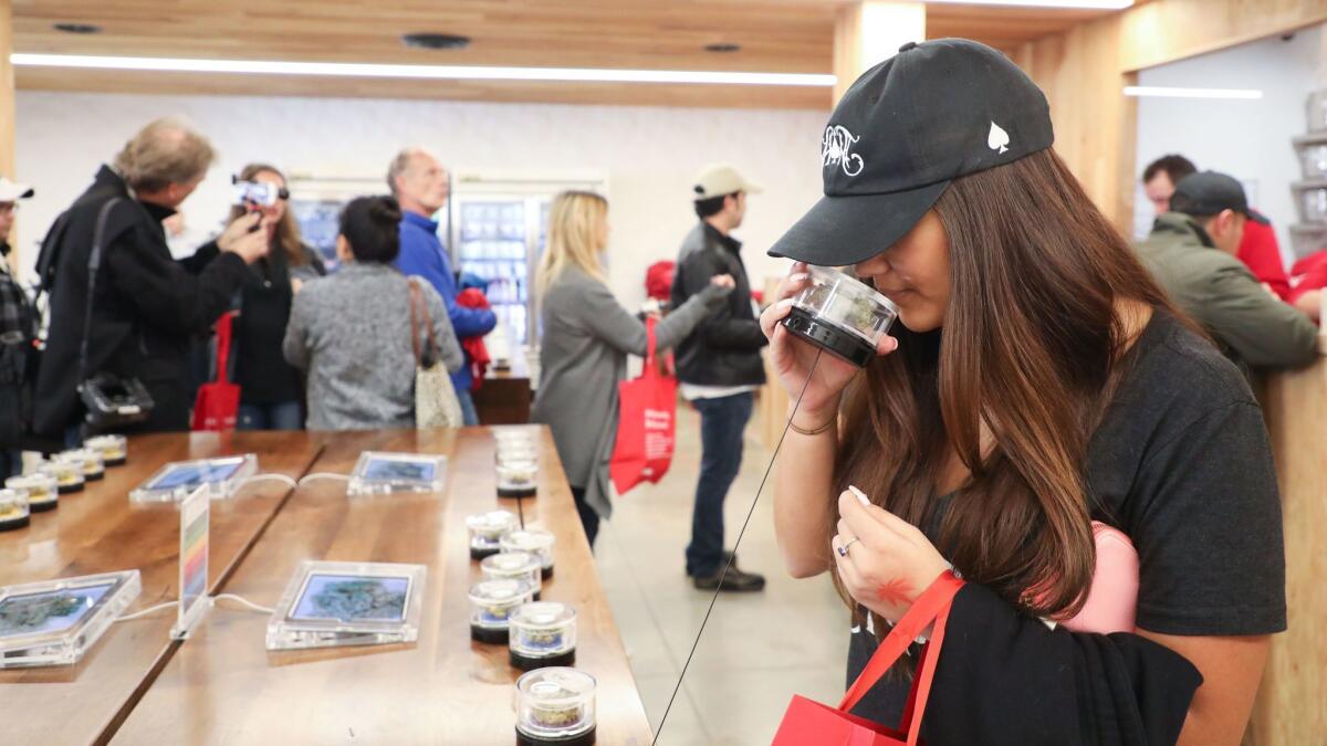A customer test-sniffs the cannabis at the MedMen dispensary in West Hollywood this month.
