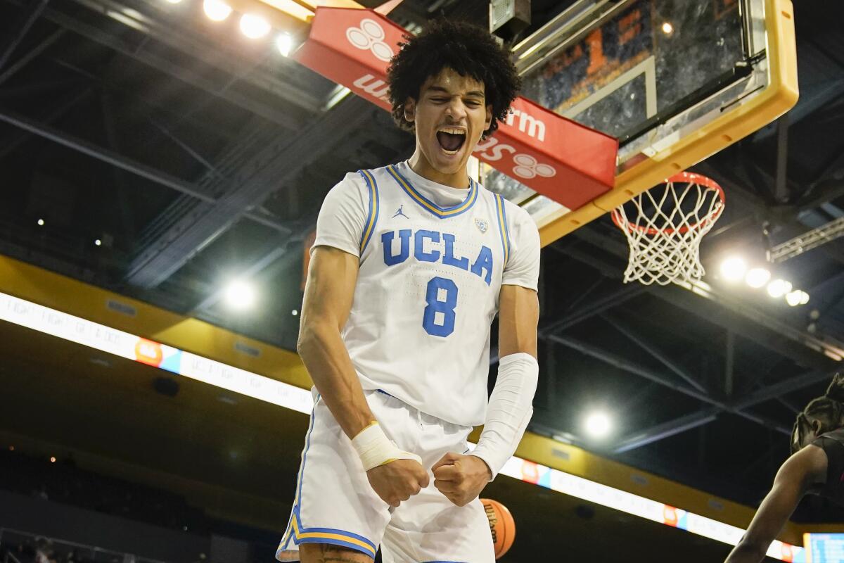 UCLA's Ilane Fibleuil flexes his muscles along the baseline after making a play earlier this season.