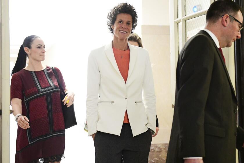 Andrea Constand, center, chief accuser in the Bill Cosby trial, returns from lunch during the Bill Cosby sexual assault trial at the Montgomery County Courthouse, Friday, April 13, 2018, in Norristown, Pa. (AP Photo/Corey Perrine, Pool)
