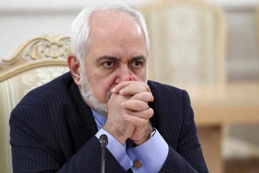 FILE - In this Jan. 26, 2021, file photo released by the Russian Foreign Ministry Press Service, Iranian Foreign Minister Mohammad Javad Zarif listens during the talks in Moscow, Russia. A recording of Iran's foreign minister offering a blunt appraisal of diplomacy and the limits of power within the Islamic Republic has leaked out publicly, providing a rare look inside the country's theocracy. (Russian Foreign Ministry Press Service via AP, File)