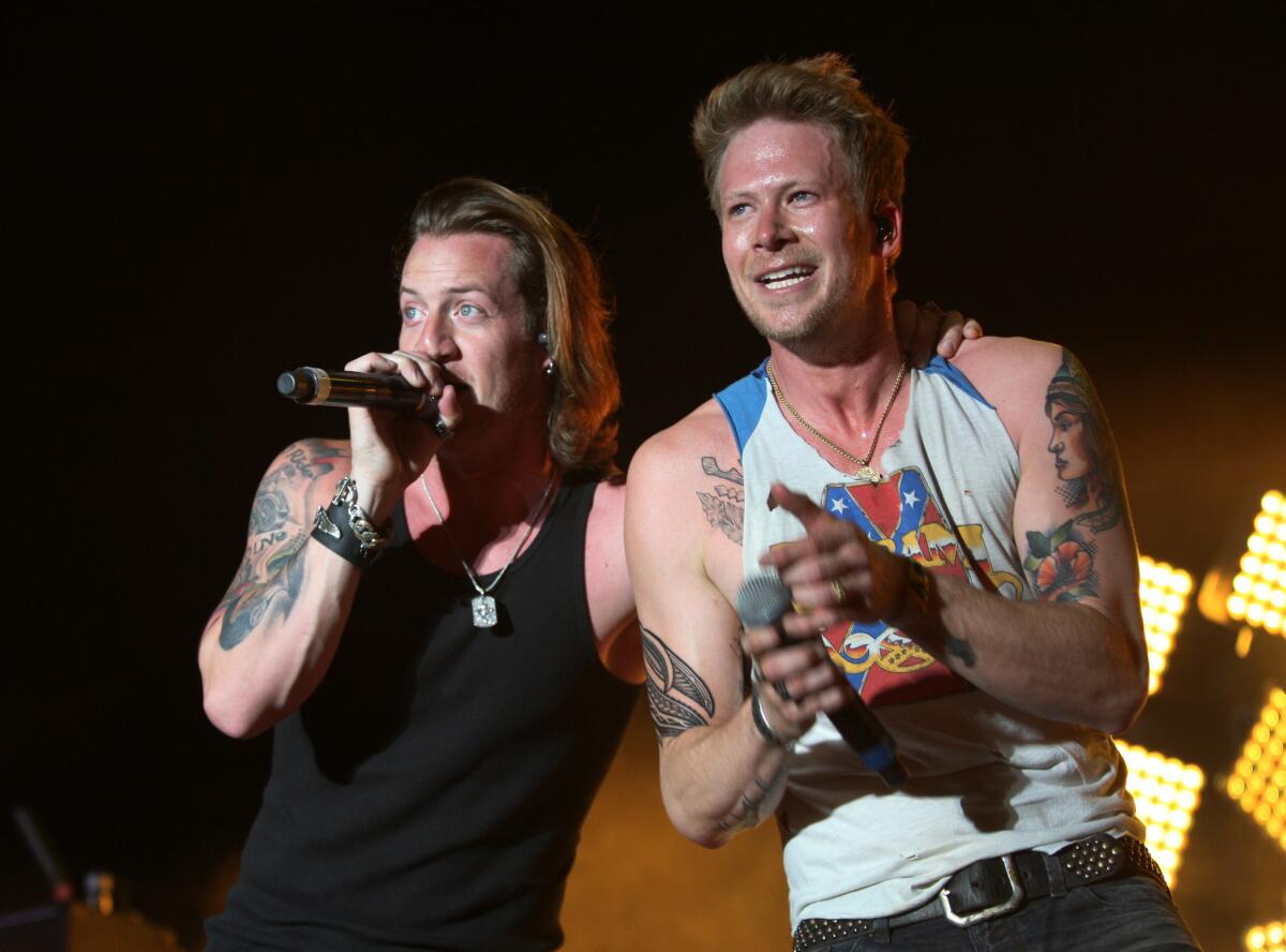 Tyler Hubbard, left, and Brian Kelley of Florida Georgia Line perform in April at the Stagecoach country music festival.