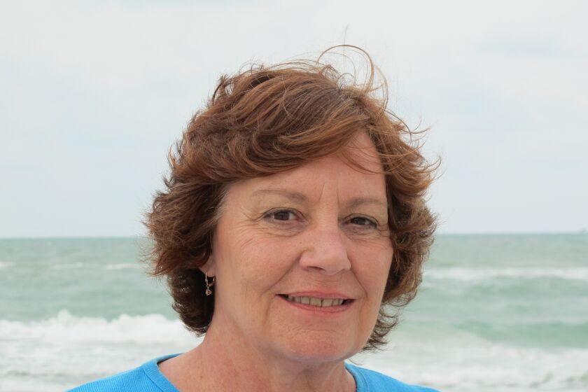 Carolyn Aiden on the beach in Naples, Florida in 2013
