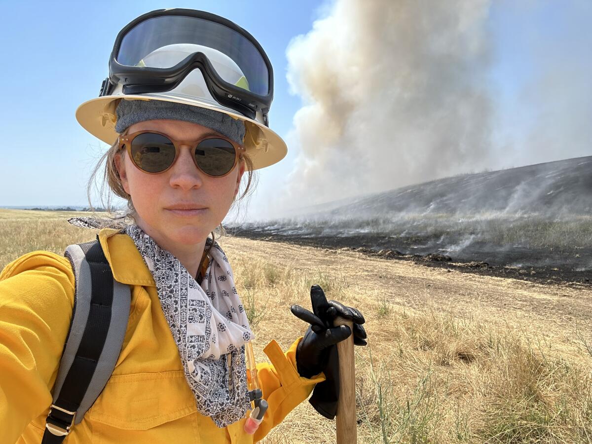 Emily Schlickman works on a controlled burn in California's Yolo County.
