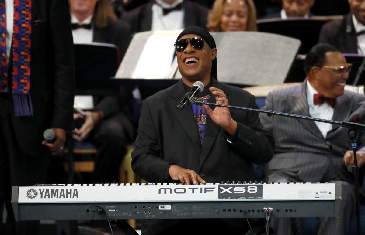 Stevie Wonder performs during the funeral service for Aretha Franklin at Greater Grace Temple in Detroit.