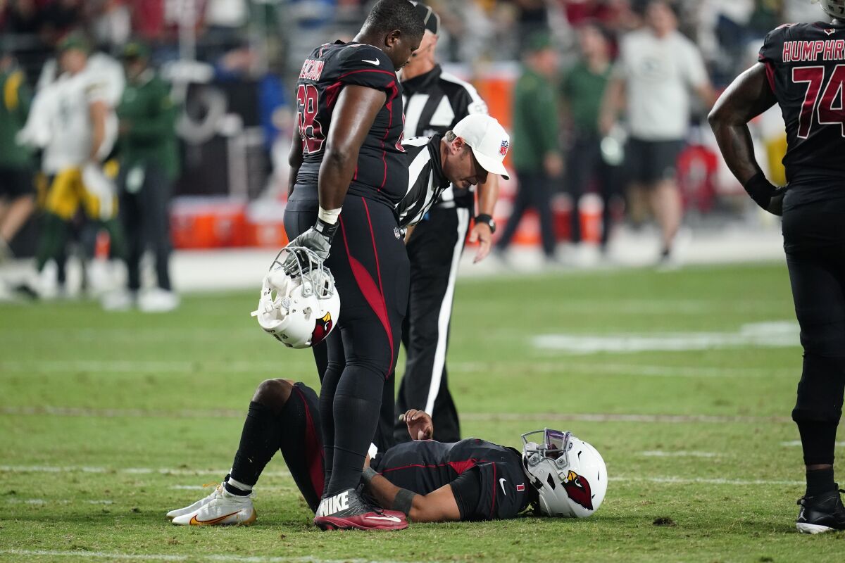 Arizona Cardinals quarterback Kyler Murray lies on the field after being hit during the second half of an NFL football game against the Green Bay Packers, Thursday, Oct. 28, 2021, in Glendale, Ariz. The Packers won 24-21. (AP Photo/Ross D. Franklin)