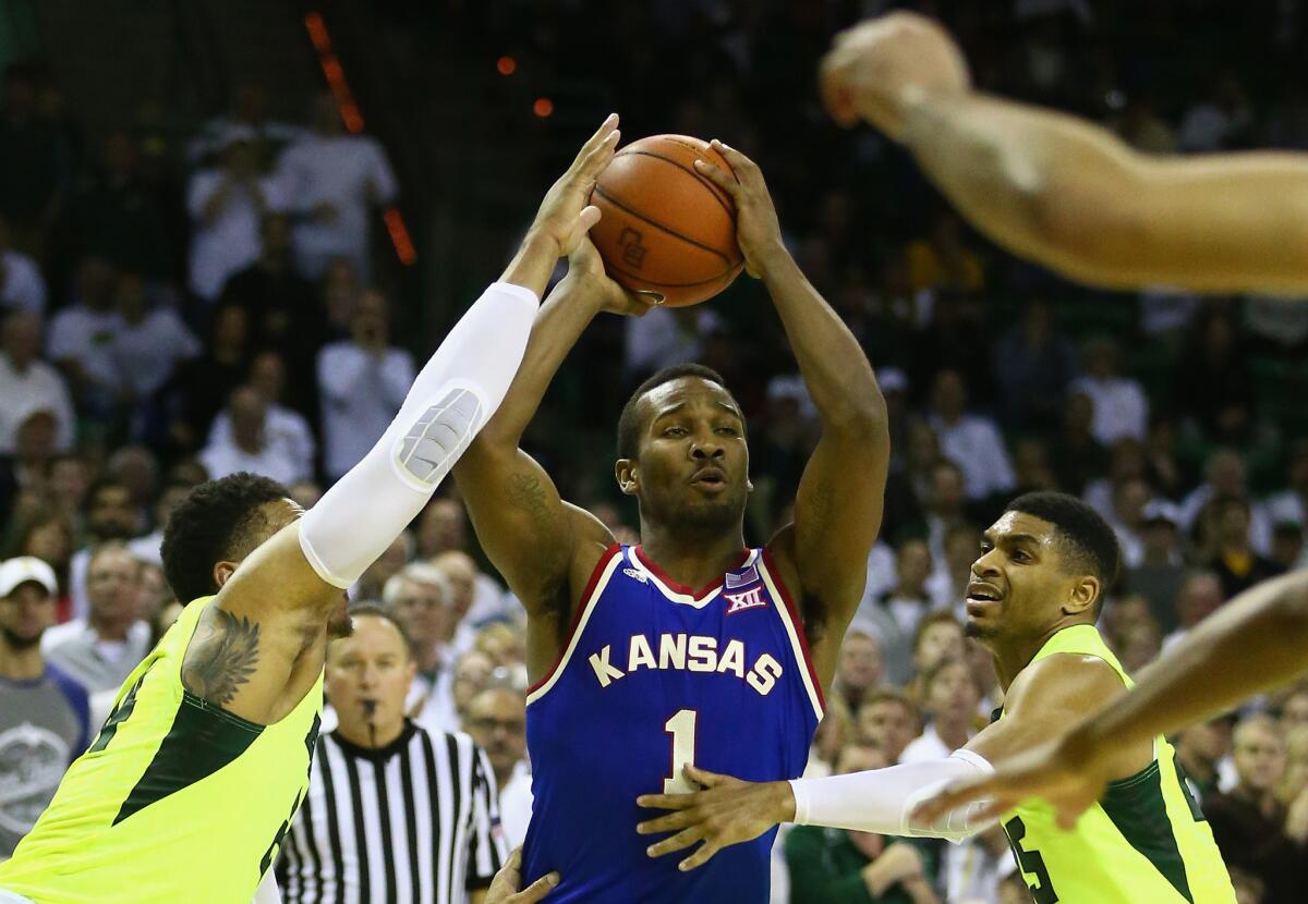 Kansas' Wayne Selden Jr. (1) looks to pass against Baylor during the first half.