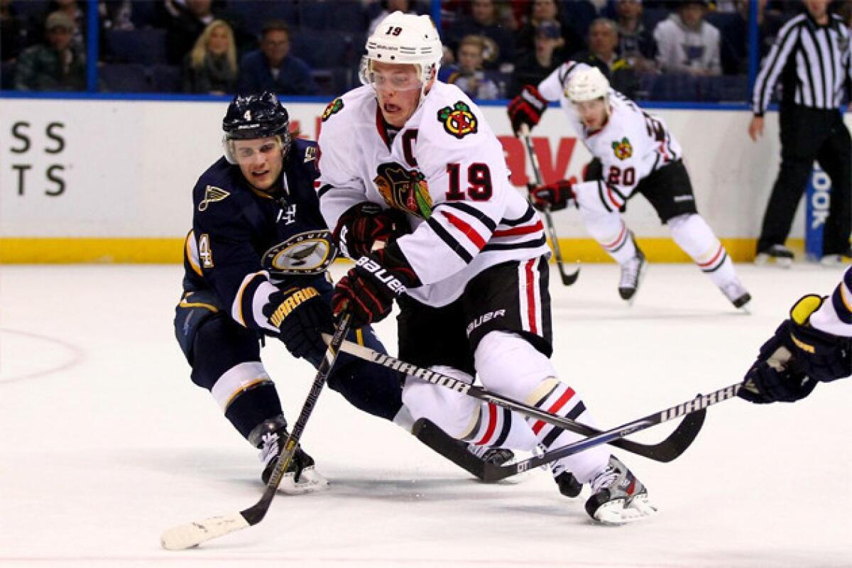 Chicago Blackhawks' Jonathan Toews (19) moves the puck up ice against the St. Louis Blues