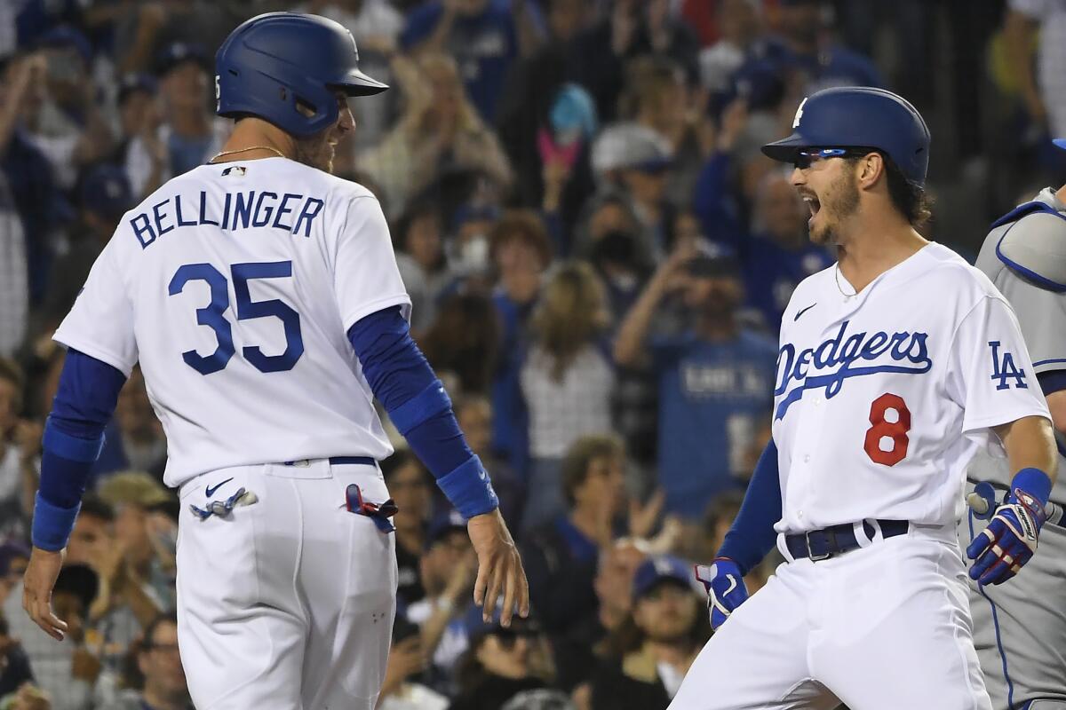 Zach McKinstry celebrates with Cody Bellinger after hitting a two-run home run.