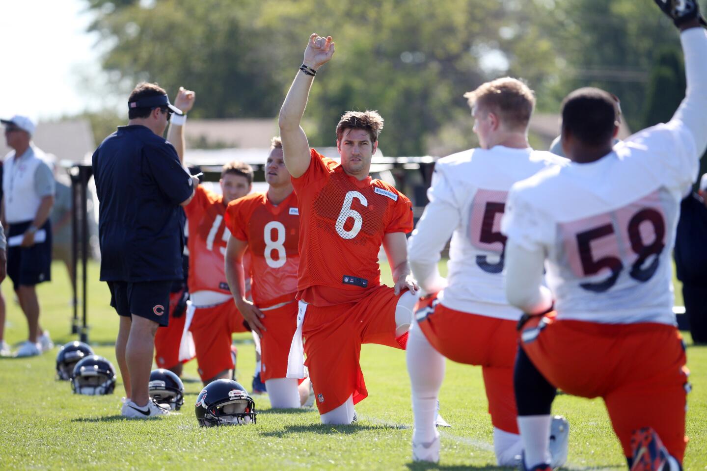 Jay Cutler stretches during the first day of training camp.