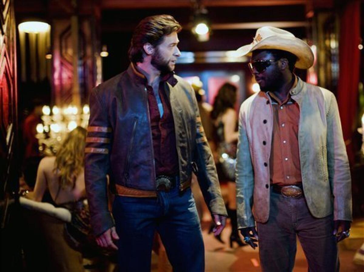 In this image released by 20th Century Fox, Hugh Jackman stars as Wolverine, left, and Will.i.am stars as John Wraith in "X-Men Origins: Wolverine". (AP Photo/20th Century Fox, James Fisher)