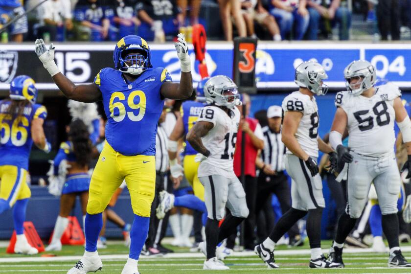  Rams guard Kevin Dotson (69) celebrates after L.A. clinched its 20-15 win over the Raiders.