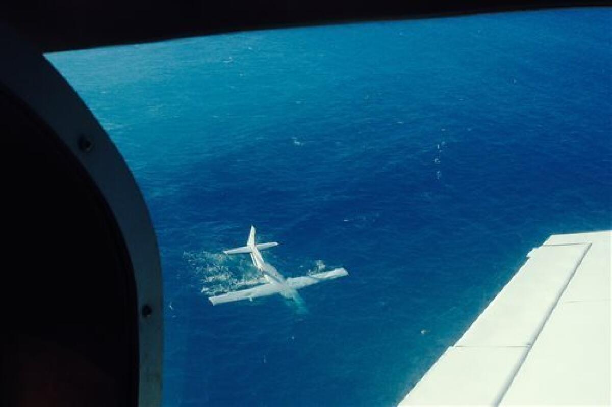 A single-engine plane floats after making an emergency landing off the island of Molokai, Hawaii, in December. The state health director died; the other eight aboard survived.