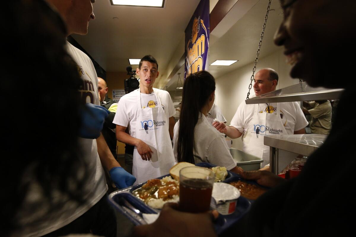 After joining the Lakers, Jeremy Lin joins teammates and Lakers staff at skid row's Midnight Mission, serving food and passing out gift bags.