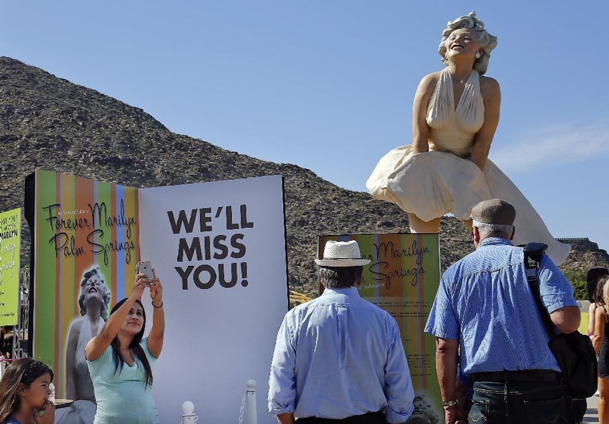 "Forever Marilyn," a statue by artist Seward Johnson, attracts fans of the late movie star in Palm Springs. The work is moving to New Jersey.