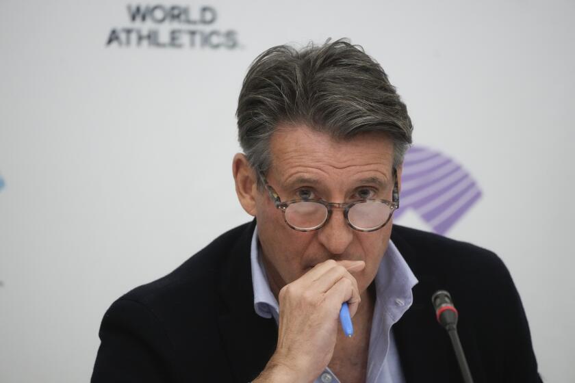 FILE - World Athletics President Sebastian Coe listens to a journalist's question during a press conference at the conclusion of the World Athletics meeting at the Italian National Olympic Committee, headquarters, in Rome, Wednesday, Nov. 30, 2022. Track and field is set to become the first sport to introduce prize money at the Olympics, with World Athletics saying Wednesday, April 10, 2024, it would pay $50,000 to gold medalists in Paris. (AP Photo/Gregorio Borgia, File)