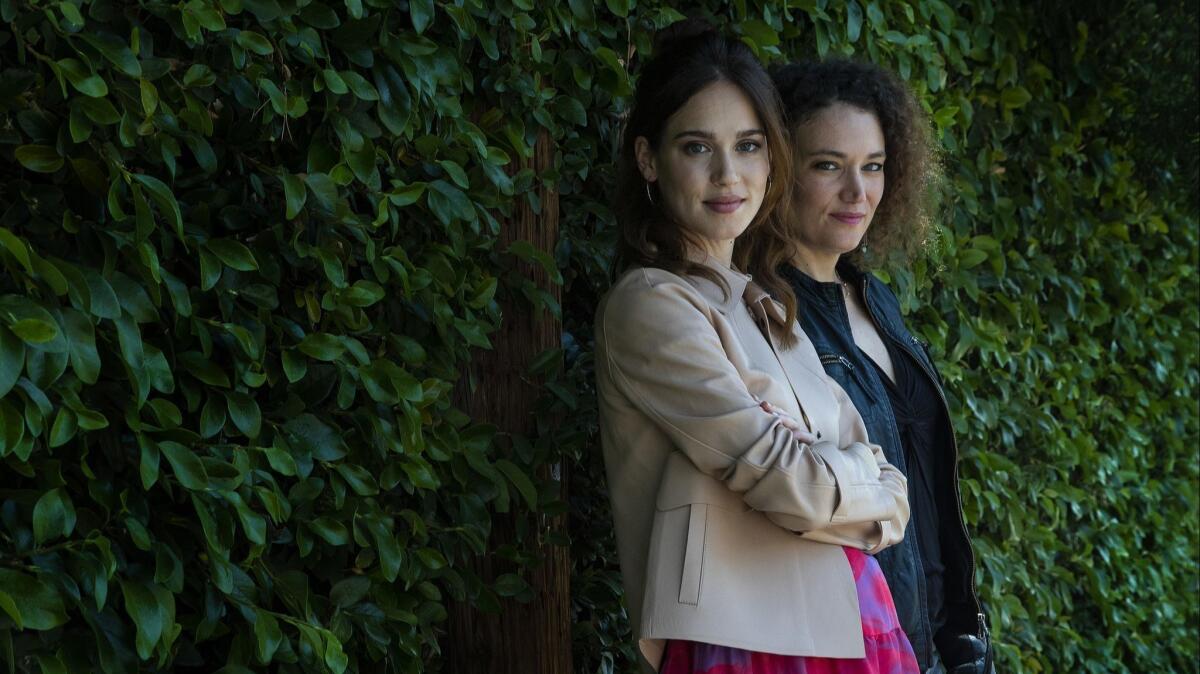 Actress Matilda Lutz, left, shown with writer-director Coralie Fargeat, stars in Fargeat's critically acclaimed vengeance thriller "Revenge," in theaters and streaming May 11.