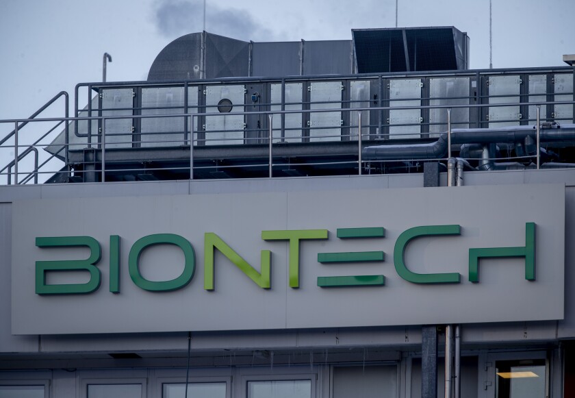 FILE - In this Saturday, Feb. 13, 2021 file photo the logo on the BioNTech biotechnology company displayed at the building where production of the COVID-19 vaccine has started, in Marburg, Germany. German pharmaceutical company BioNTech reported a net profit of 1.13 billion euros, about 1.37 billion US dollars, in the first quarter of this year on the back of strong revenues from its coronavirus vaccine. (AP Photo/Michael Probst, file)