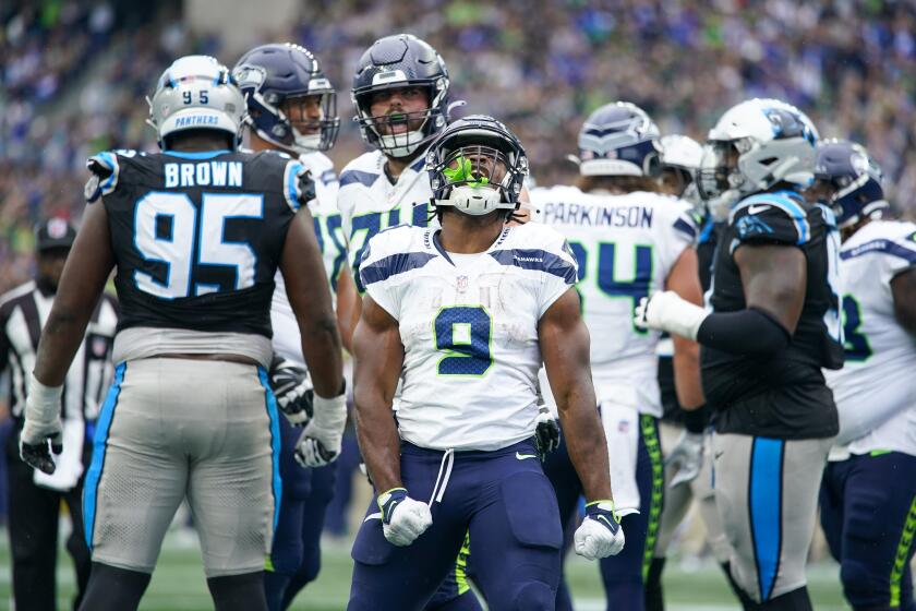 Seattle Seahawks running back Kenneth Walker III celebrates after scoring against the Carolina Panthers during the second half of an NFL football game Sunday, Sept. 24, 2023, in Seattle. (AP Photo/Lindsey Wasson)
