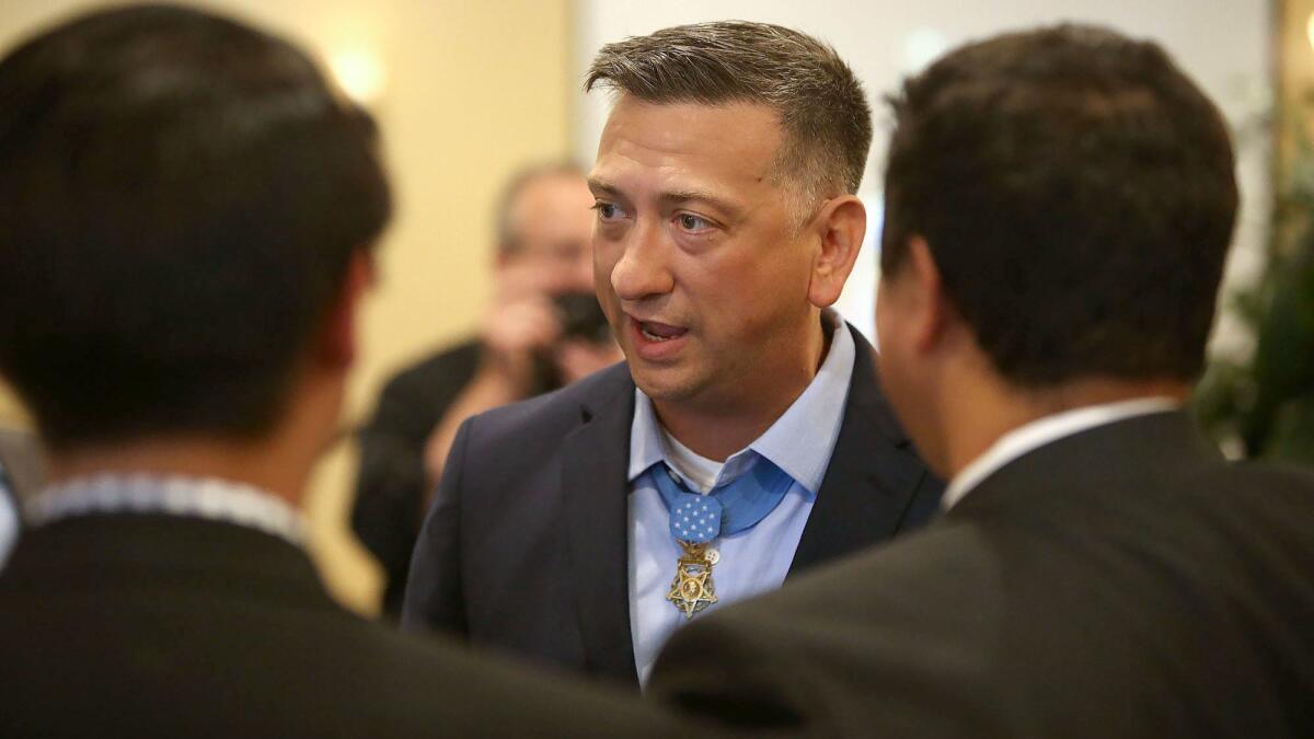 Staff Sgt. David Bellavia, the first living Medal of Honor recipient from the second Iraq War, speaks to guests during a private event hosted by the Yorba Linda non-profit For Families of Active Military at the Yorba Linda Country Club on Thursday.