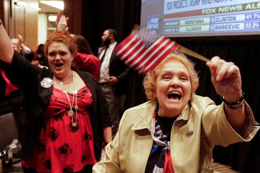 Lyn Thrasher, right, of Greensboro, N.C., and her daughter, Marley Thrasher, left, of Raleigh, watch elections results at a rally for North Carolina Gov. Pat McCrory in Raleigh, N.C.
