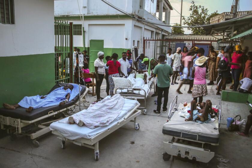 People injured during the earthquake are treated in the hospital in Les Cayes, Haiti, Sunday, Aug. 15, 2021. The death toll from a magnitude 7.2 earthquake in Haiti climbed to more than 1,200 on Sunday as rescuers raced to find survivors amid the rubble ahead an approaching tropical storm. (AP Photo/Joseph Odelyn)