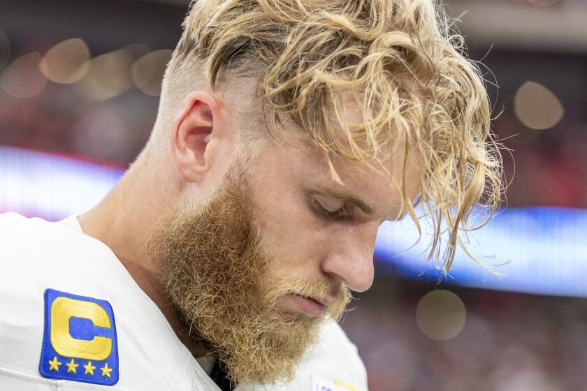 Rams wide receiver Cooper Kupp (10) hangs his head in Arizona before a game against the Cardinals.