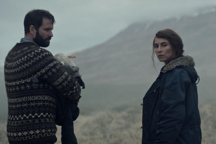 Hilmir Snaer Gudnason and Noomi Rapace in the 2021 horror drama “Lamb.”