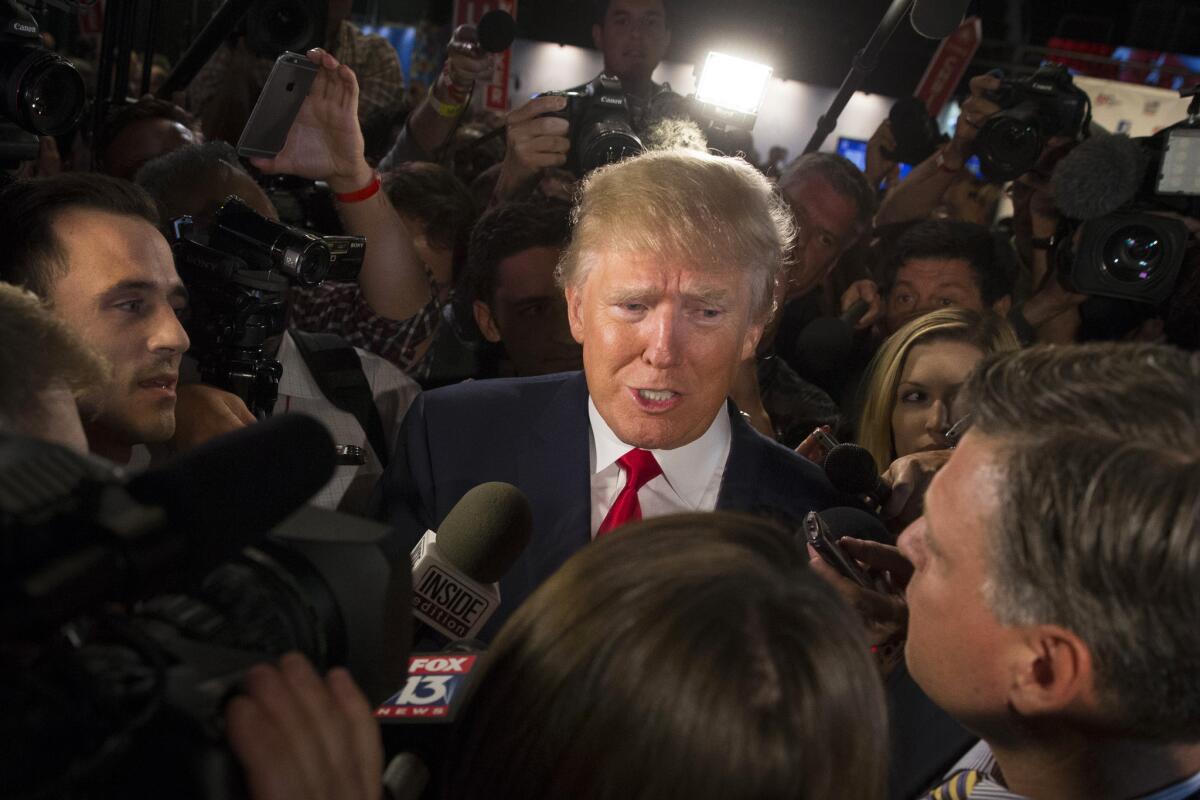 Donald Trump is mobbed by media outlets after the first Republican presidential debate. His lead in the polls has led publisher Thomas Dunne to move up the publication date of a new biography -- twice.