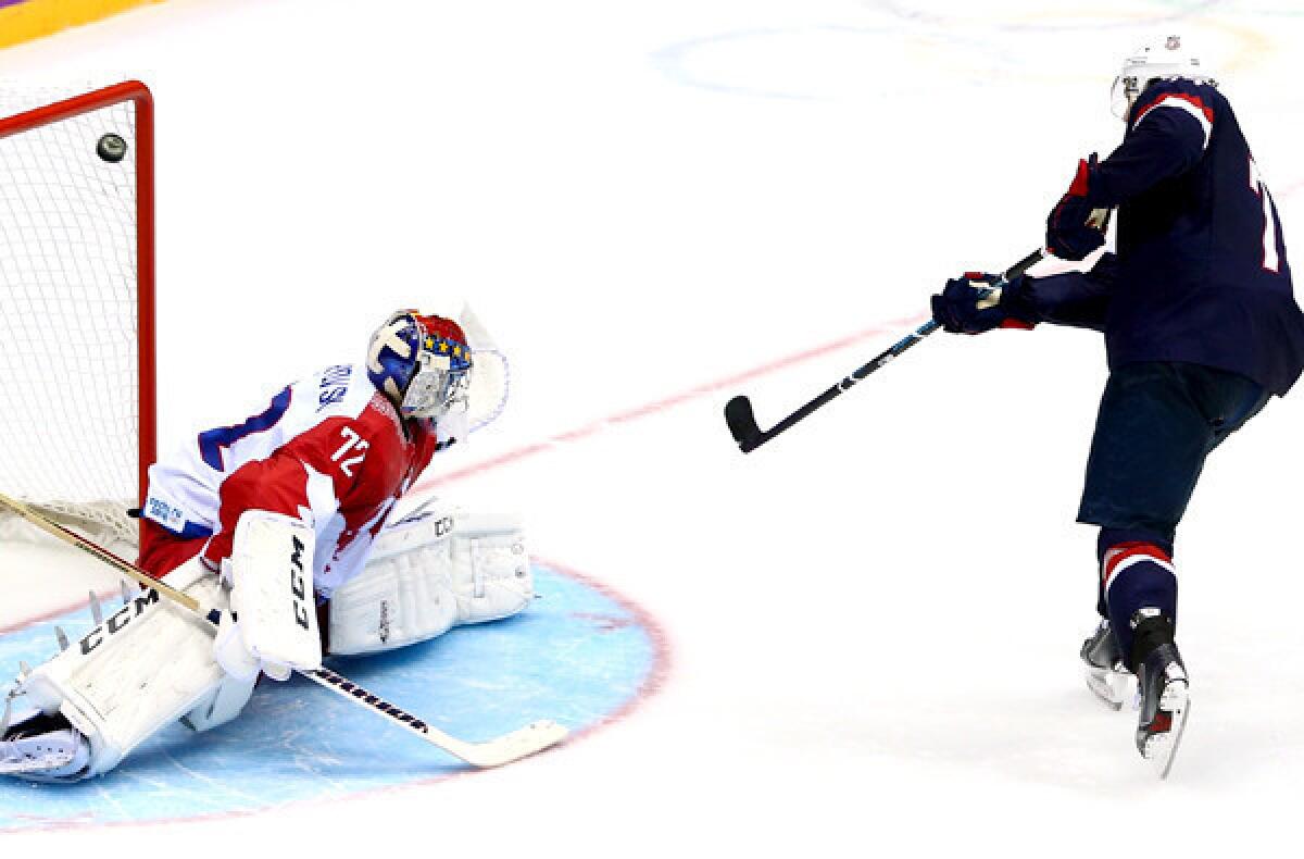 U.S. forward T.J. Oshie beats Russia goaltender Sergei Bobrovski during the shootout in a preliminary-round game at the Sochi Olympics on Saturday.