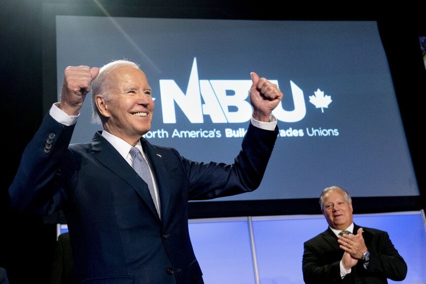 President Joe Biden pumps his fists after speaking at the North America's Building Trades Union National Legislative Conference at the Washington Hilton in Washington, Tuesday, April 25, 2023. (AP Photo/Andrew Harnik)