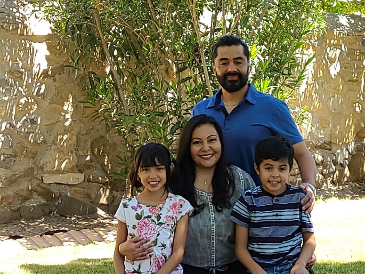 A smiling family of four