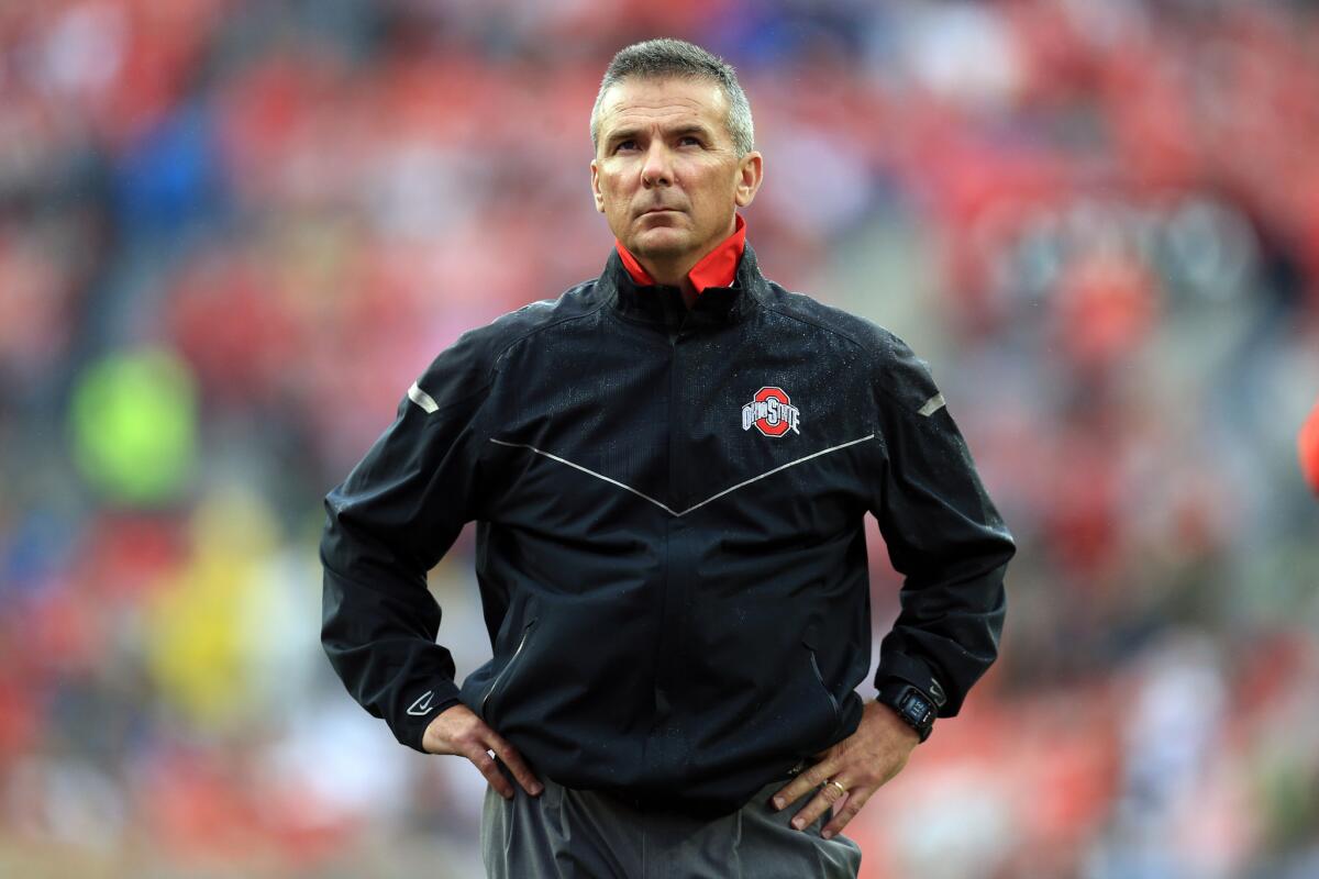 Ohio State Coach Urban Meyer prepares to coach the Buckeyes against the Northern Illinois Huskies on Sept. 19.